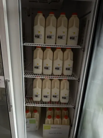 A refrigerator with milk inside.