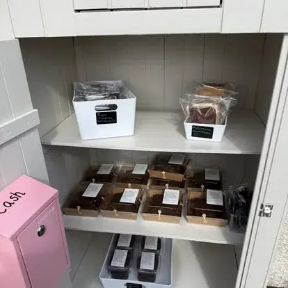 A pink box with a cash slot on the side.
