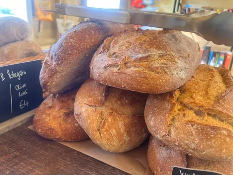 A stack of bread on a table.