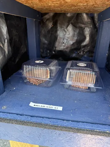 A blue box with two plastic containers inside.