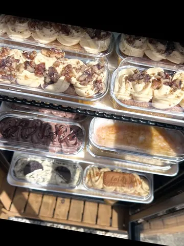 A display case filled with various desserts.