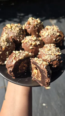 A plate with a chocolate dessert on it.