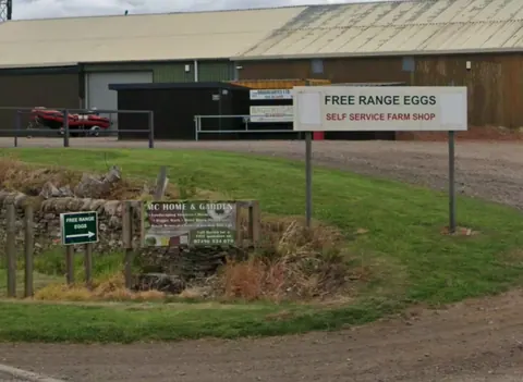 A sign advertising free range eggs.