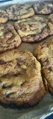 A close up of a chocolate chip cookie.