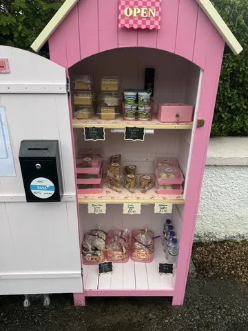 A pink box with a black box inside of it.