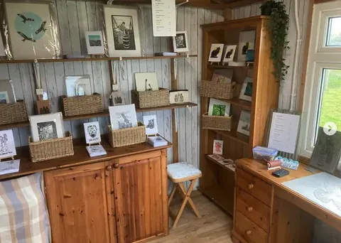 A wooden cabinet with a sign on top of it.