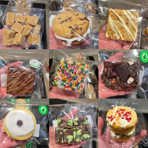 A person is holding a bag of cookies.