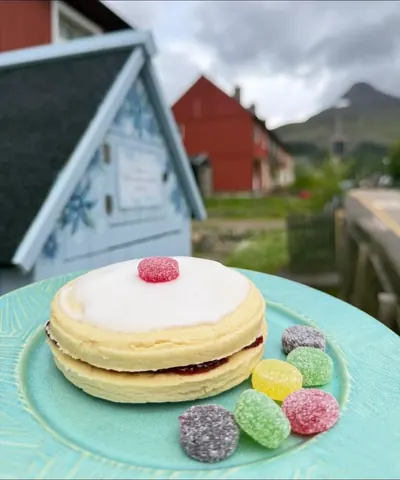 A plate with a jelly-filled pastry and jelly beans.