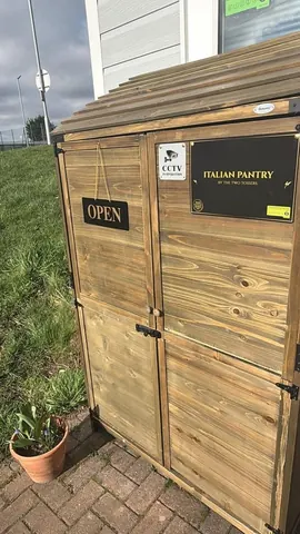 A wooden box with a sign that says open.