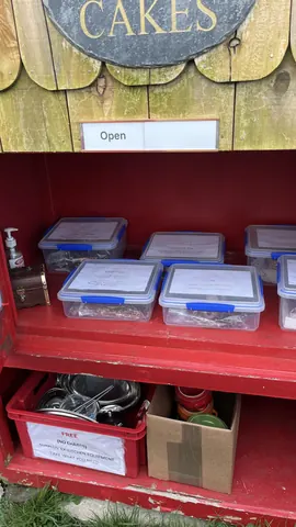A red cabinet with a sign that says open.
