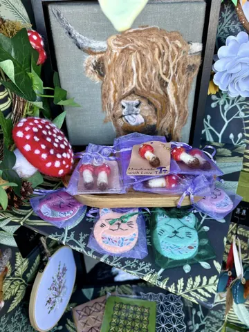 A painting of a bull with a mushroom on a table.