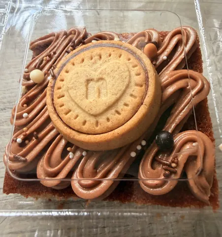 A cookie with a heart on top of it.
