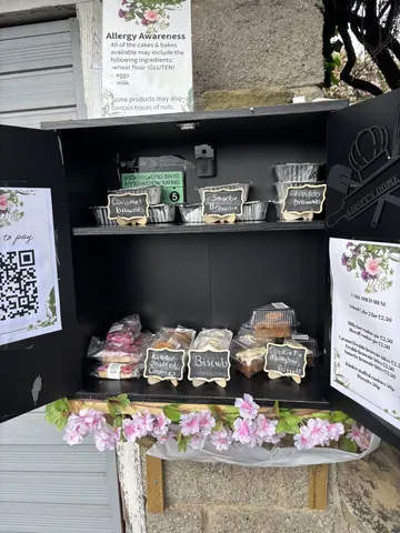 A display of cupcakes and other baked goods.