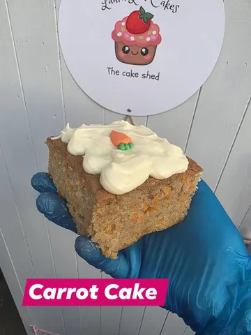 A person is holding a slice of cake.
