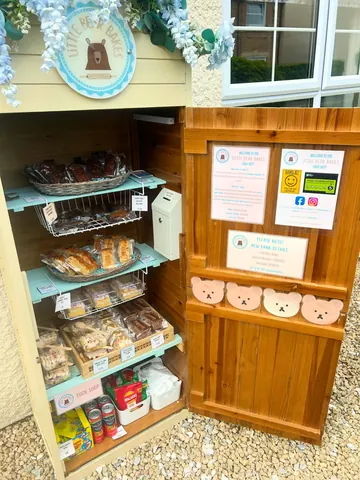 A wooden box with a sign that says "free stuff".
