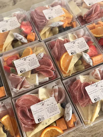 A box of food with a label that says "The Mayfair".