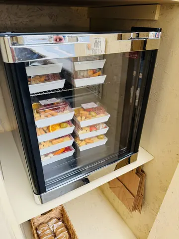 A refrigerator with food in it.