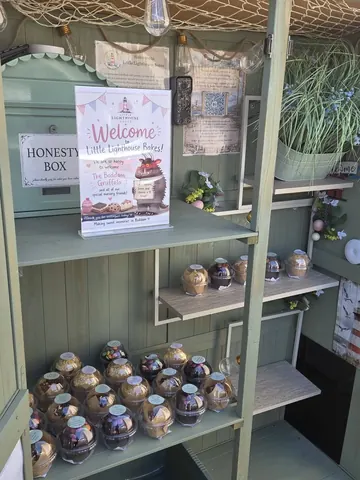A display of baked goods in a green box.