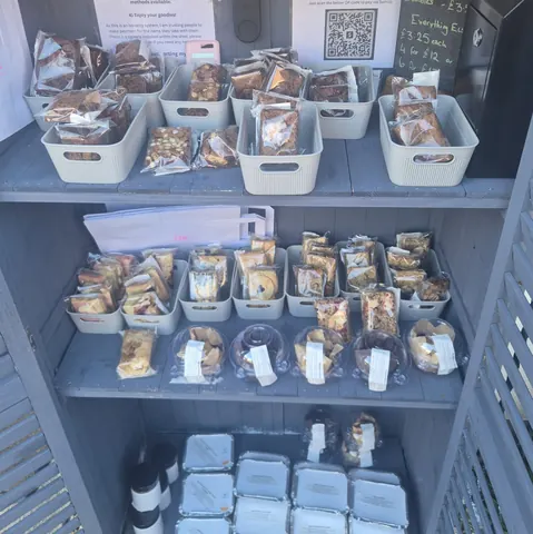 A shelf with a bunch of food on it.