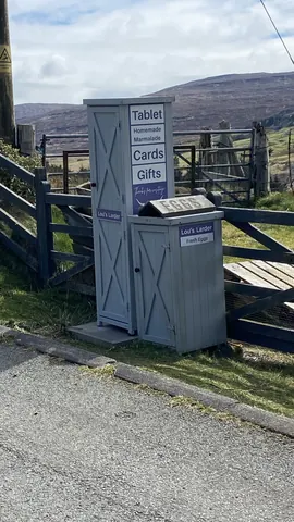 A small building with a sign on it that says "eggs".