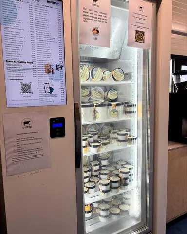A refrigerator with a sign on the door.