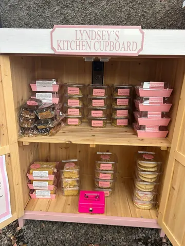 A pink box with a pink box on top of it.
