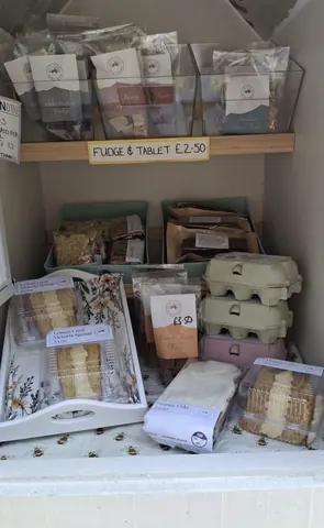A display of food items, including cakes, eggs, and other baked goods.