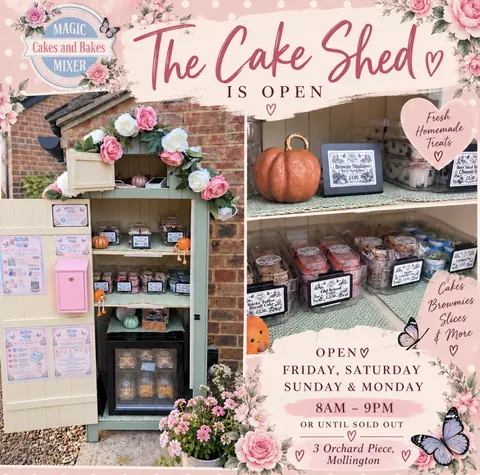 A cake shop with a pink door and a sign that says "The Cake Shed".