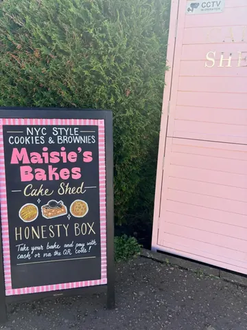 A sign advertising cookies and brownies.