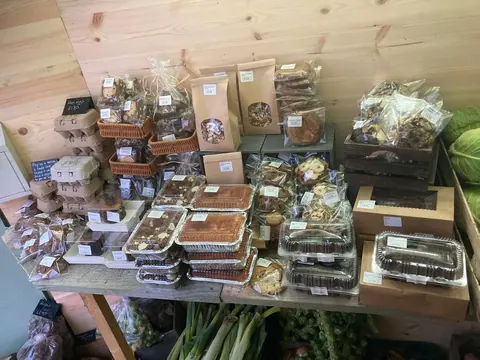 A table full of food items, including cookies and cakes.