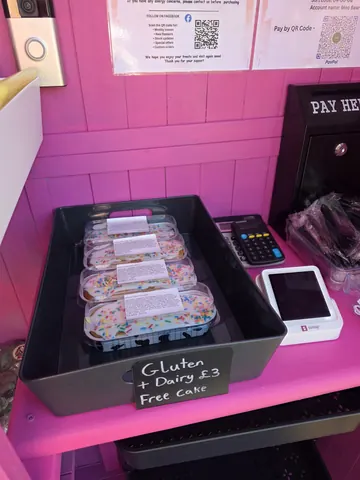 A box of gluten-free cakes is on a table.