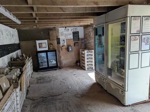 A white refrigerator is sitting in a room.