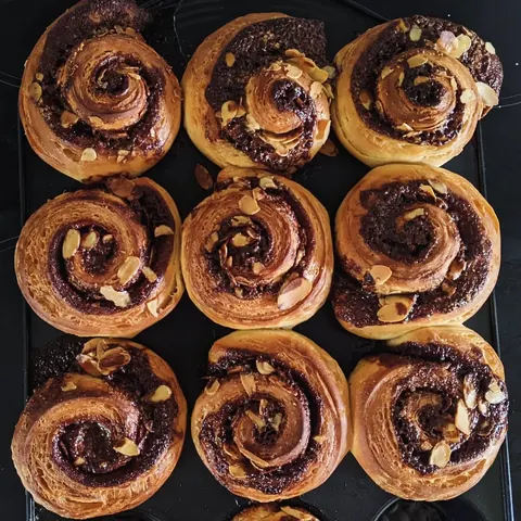 A tray of pastries with various flavors.