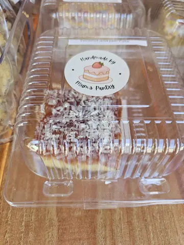 A cake in a plastic container.