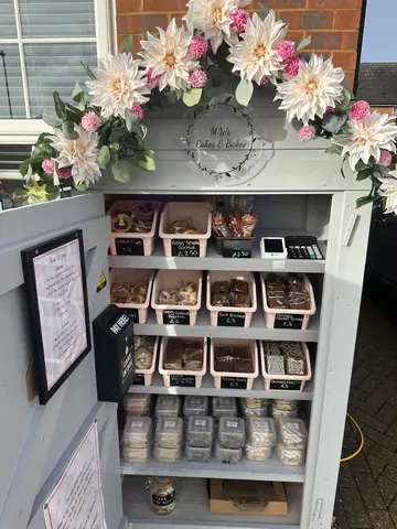 A display case with a variety of food items in it.