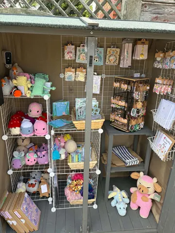 A small room with a shelf full of stuffed animals.