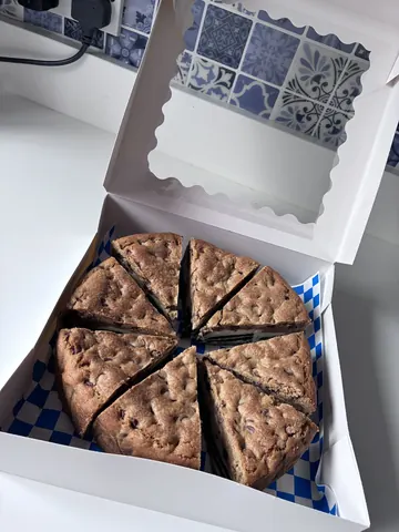 A slice of cake is in a box.