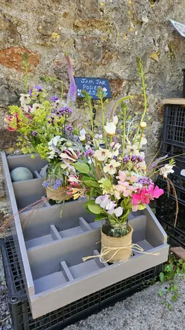 A vase of flowers is sitting on a table.