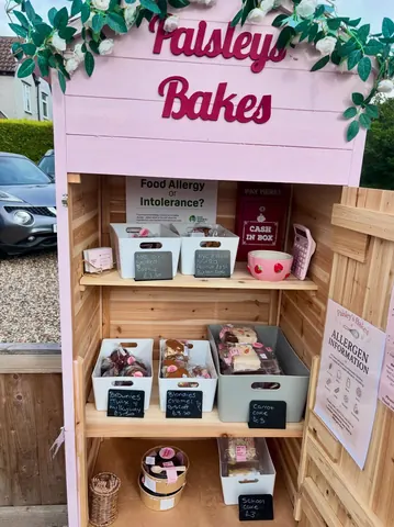 A pink food stand with a sign that says "Food Allergy Intolerance?"