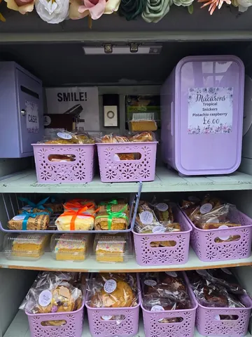A purple container with a sign that says "smile!" on it.