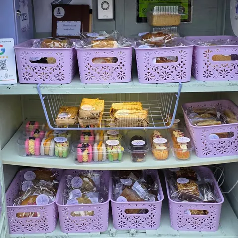 A display of food in a pink basket.
