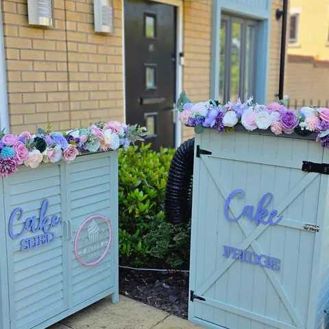 Two blue doors with flowers on them.