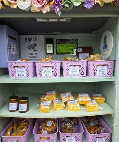 A display case with a sign that says "smile" and a camera.