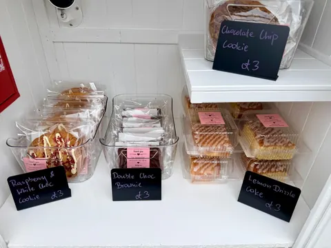 A table with a variety of food items on it.