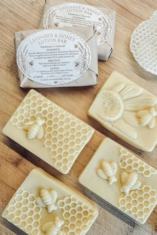 A bar of soap with a bee on it.