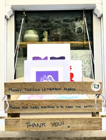 A sign that says money through letterbox please.