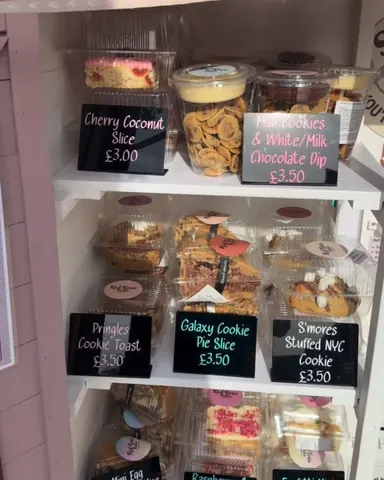 A display case with various desserts in it.