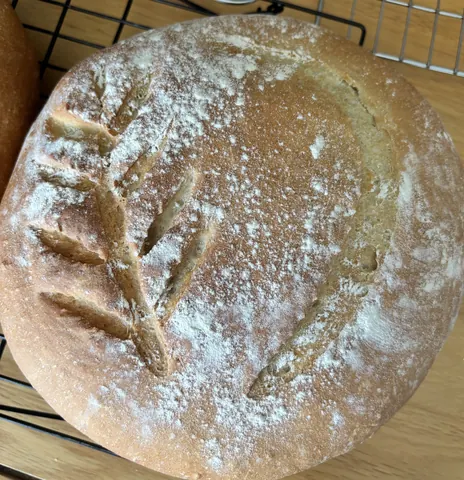 A loaf of bread with a leaf design on it.