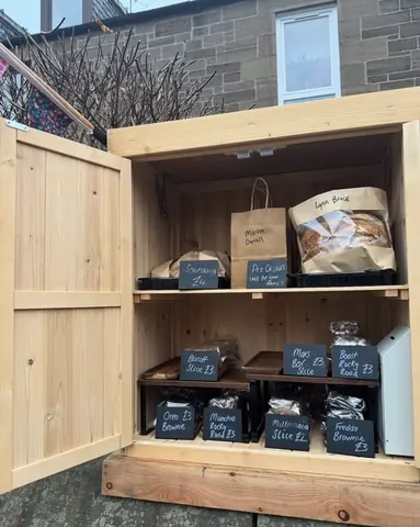 A wooden box with a sign that says "Marmite" on it.