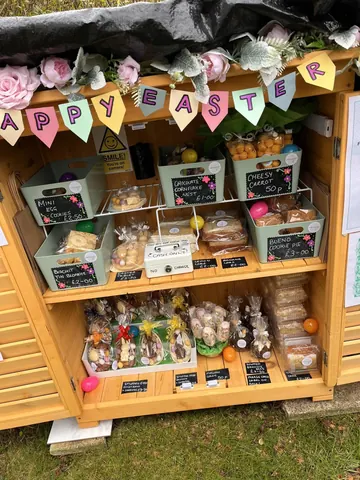 A wooden display case with a sign that says "Happy Easter" on it.